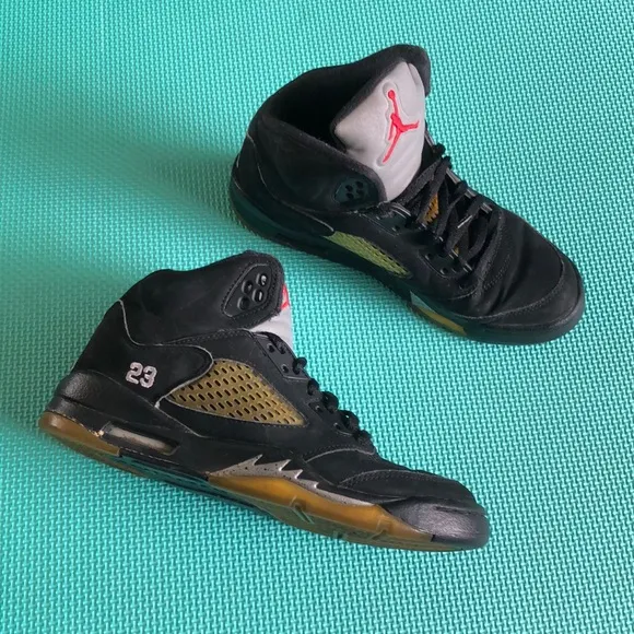 Air Jordan Kids Black and Gold Sneakers with Red Logo