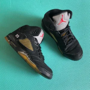 Air Jordan Kids Black and Gold Sneakers with Red Logo