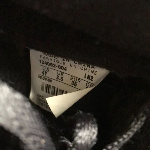 Air Jordan Kids Black and Gold Sneakers with Red Logo