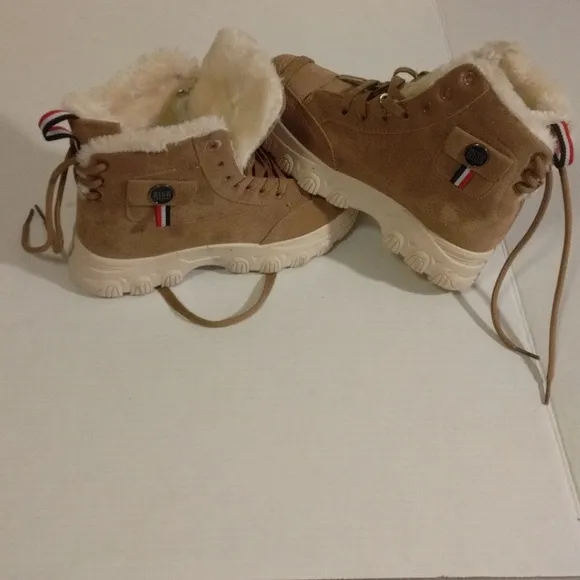 Bikk embebgs fur ankle boots adjusting straps in the back lightly worn size 8