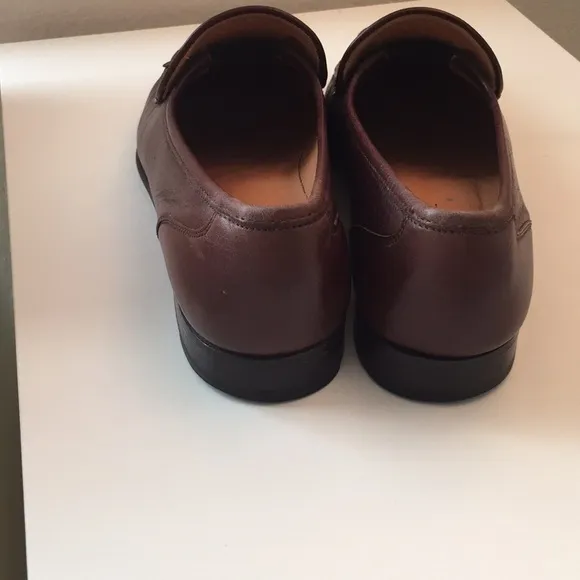 Bruno Magli brown tassel leather loafers.