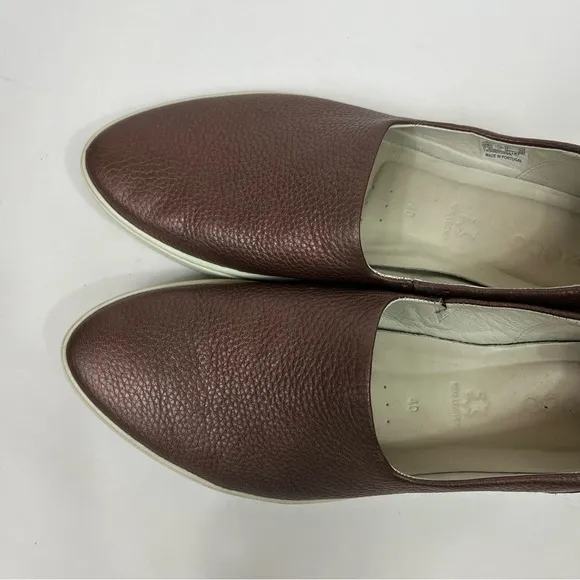 Ecco Gillian slip on leather sneakers.