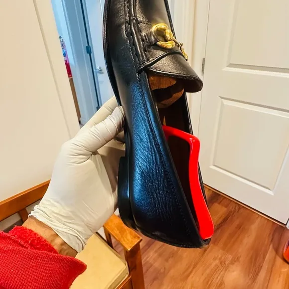 Jay Butler’s Horse Bit Black Leather Loafers with Gold Buckle.