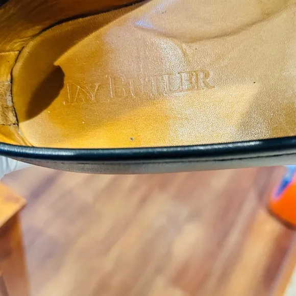 Jay Butler’s Horse Bit Black Leather Loafers with Gold Buckle.