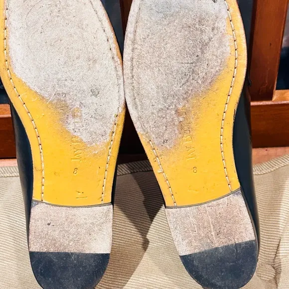 Jay Butler’s Horse Bit Black Leather Loafers with Gold Buckle.