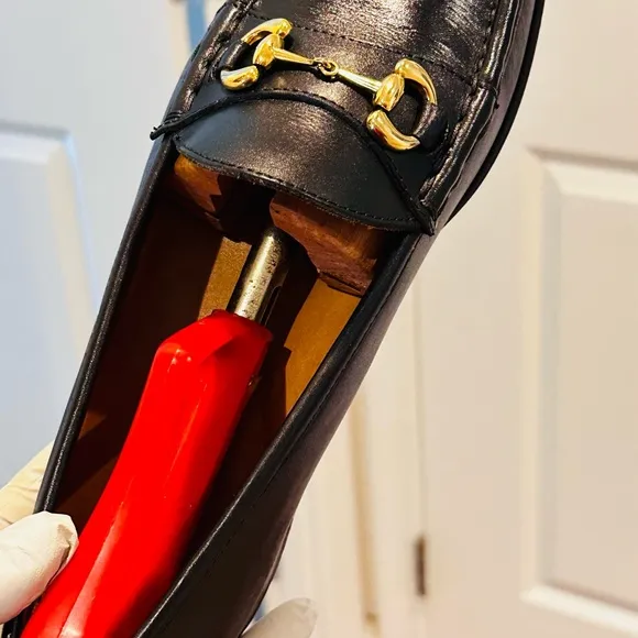 Jay Butler’s Horse Bit Black Leather Loafers with Gold Buckle.