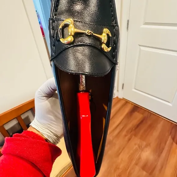 Jay Butler’s Horse Bit Black Leather Loafers with Gold Buckle.