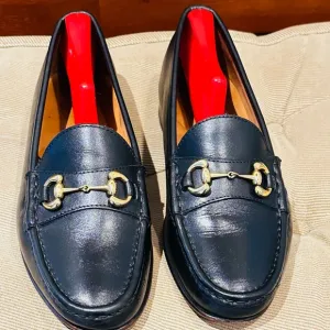 Jay Butler’s Horse Bit Black Leather Loafers with Gold Buckle.