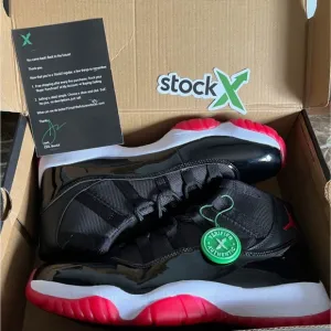 Jordan 11 Black and Red Sneakers