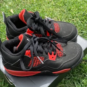 Jordan 4 Black and Red Sneakers with Mesh Panels