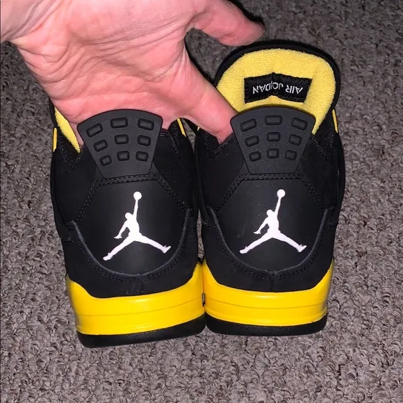 Jordan 4 Black/Yellow Thunder Sneakers