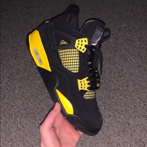 Jordan 4 Black/Yellow Thunder Sneakers