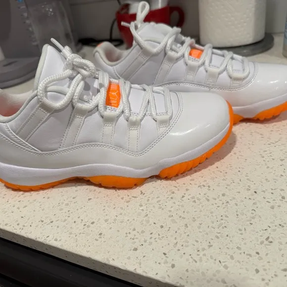 Jordan White and Orange Sneakers with Classic Silhouette