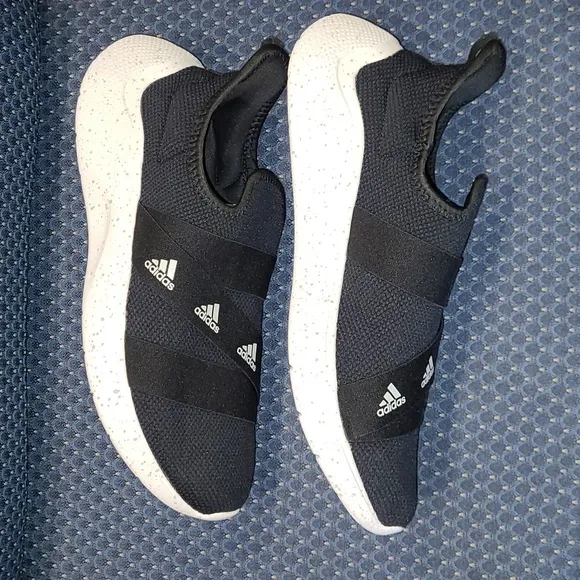 NWOT-Adidas Slip-on Sneakers.  BLACK AND WHITE.  Woman's size 12/men's size 10.5