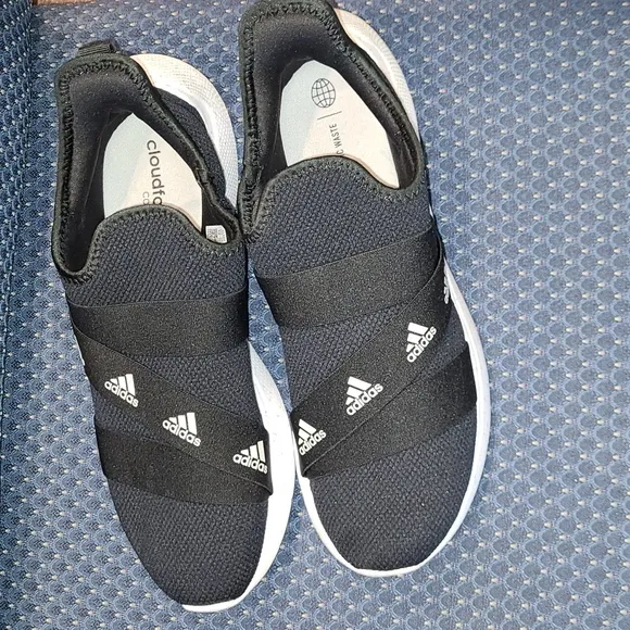 NWOT-Adidas Slip-on Sneakers.  BLACK AND WHITE.  Woman's size 12/men's size 10.5