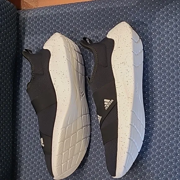 NWOT-Adidas Slip-on Sneakers.  BLACK AND WHITE.  Woman's size 12/men's size 10.5