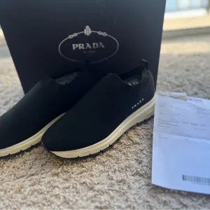 Prada Black Slip-On Sneakers with Modern Silhouette
