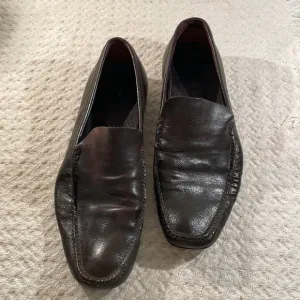 PRADA Chocolate Brown Sleek Loafers with Character