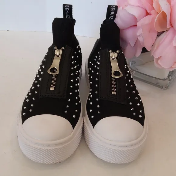 Schutz Black zip front studded slip on sneakers