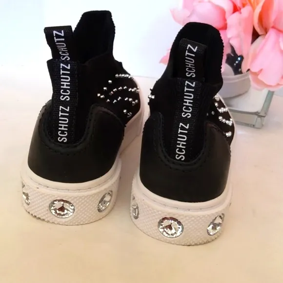 Schutz Black zip front studded slip on sneakers