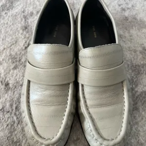 The Row Cream Loafers Slip-Ons