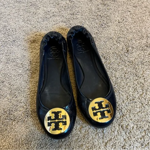 Tory Burch Black and Gold Leather Loafers with Signature Medallion