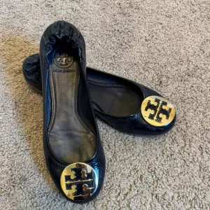 Tory Burch Black and Gold Leather Loafers with Signature Medallion