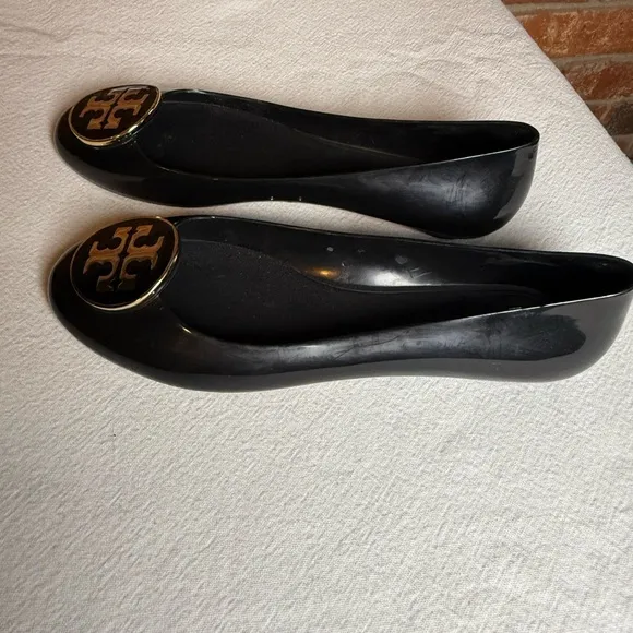 Tory Burch waterproof PVC jelly Reva black with gold tone logo slip on flats
