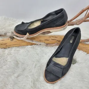 Ugg tasseled leather loafers.  Black