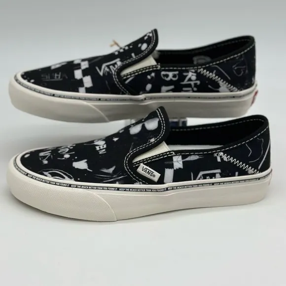Vans Black and White Slip-On Sneakers with Graphic Design