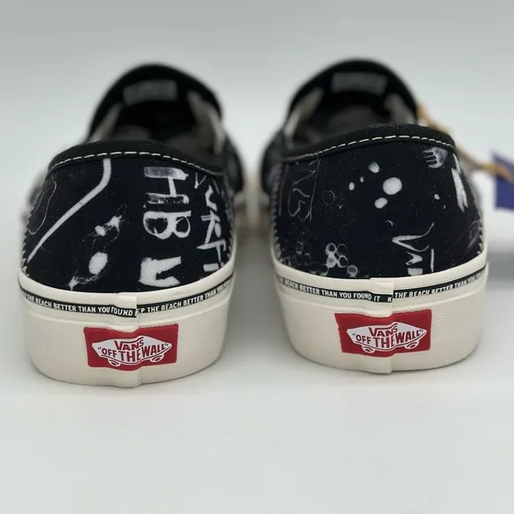Vans Black and White Slip-On Sneakers with Graphic Design