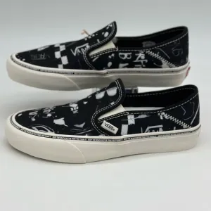Vans Black and White Slip-On Sneakers with Graphic Design