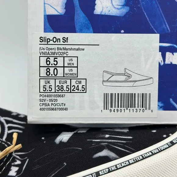 Vans Black and White Slip-On Sneakers with Graphic Design