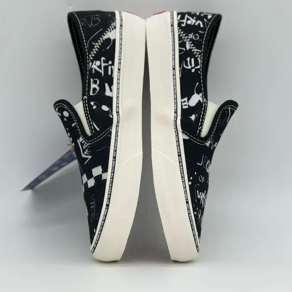 Vans Black and White Slip-On Sneakers with Graphic Design