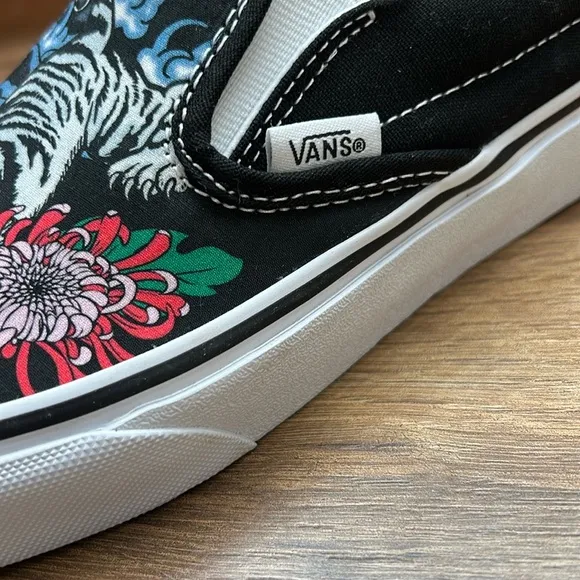 Vans Black Slip-On Sneakers with Colorful Floral Design