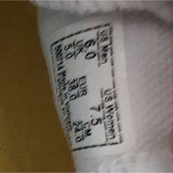 Vans White Canvas Slip-On Sneakers