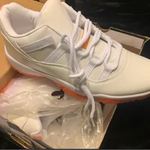 White and Orange Crush 11 Low-Top Sneakers